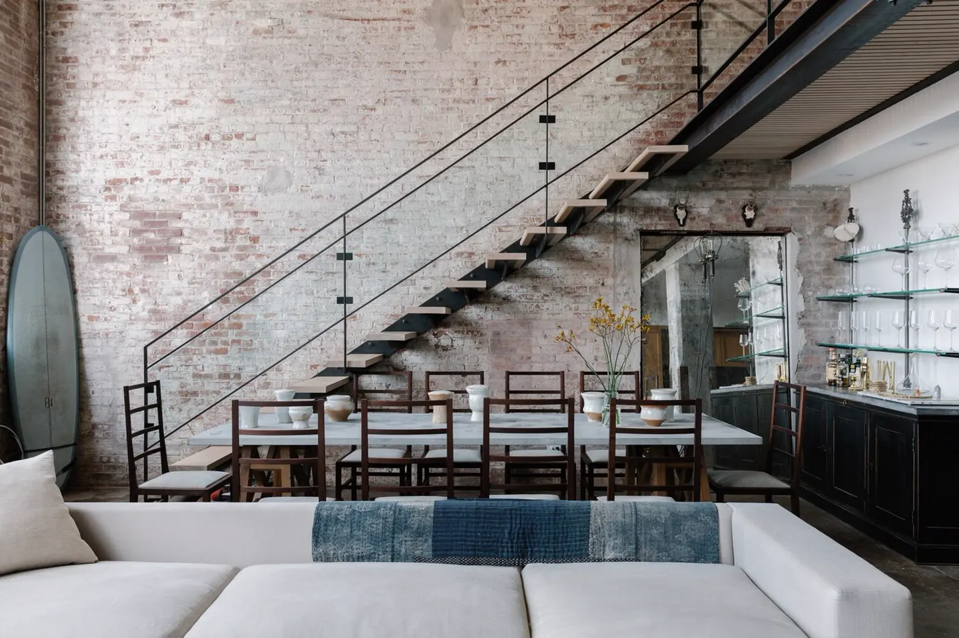 Dining area and stairwell in a renovated Williamsburg, Brooklyn loft