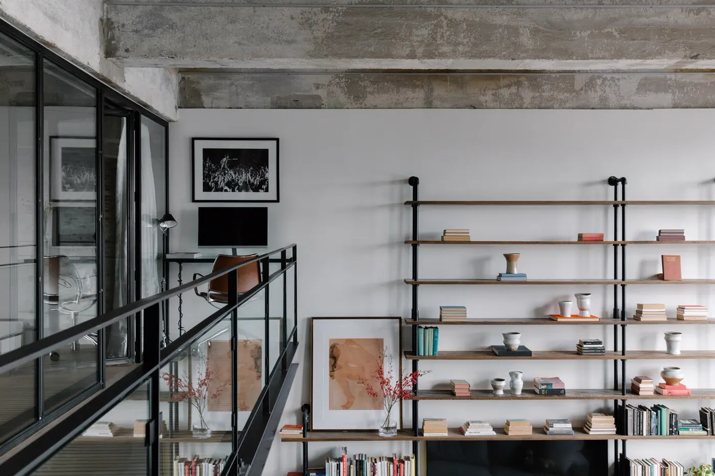 Catwalk and bookshelf in a renovated Williamsburg, Brooklyn loft