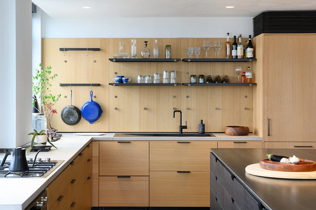 Wood kitchen cabinetry, open shelves and a dark island in Williamsburg, Brooklyn