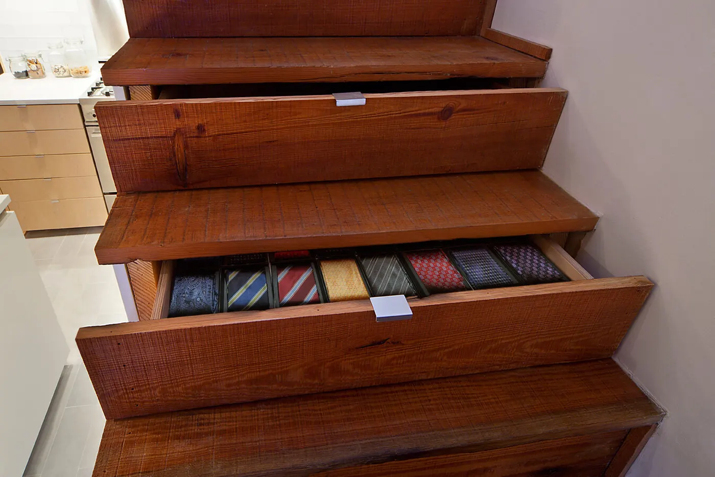 Close-up of the Crane Residence staircase with drawers built into the steps for hidden storage
